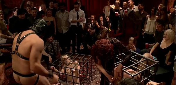  Caged blonde slaves are group fucked